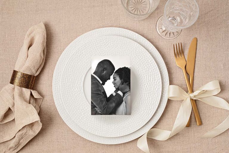 Festive wedding, birthday table setting with golden cutlery and porcelain plate bw